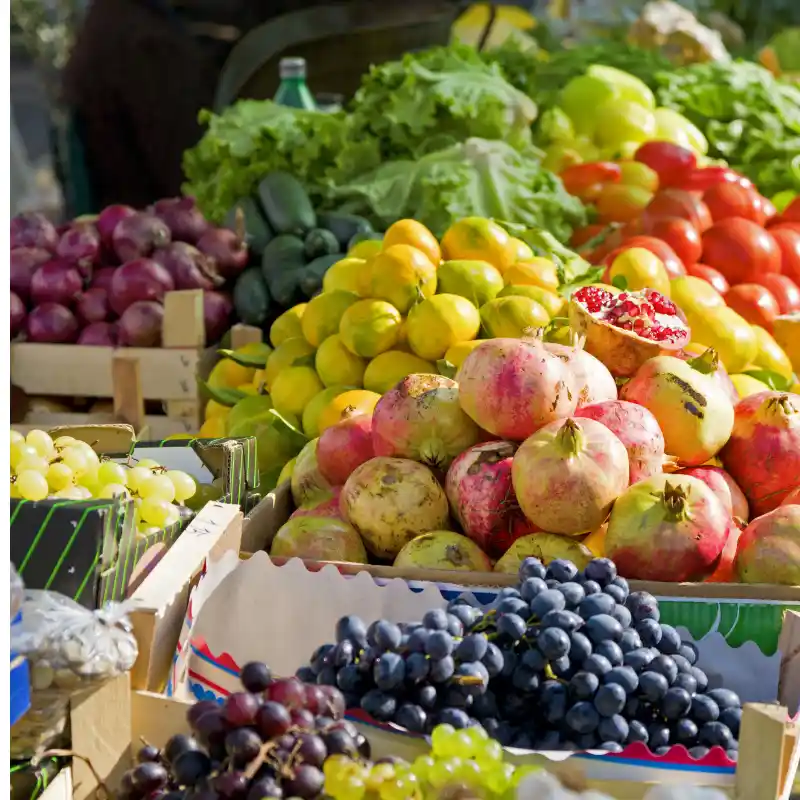 d stall with different fruits and grapes