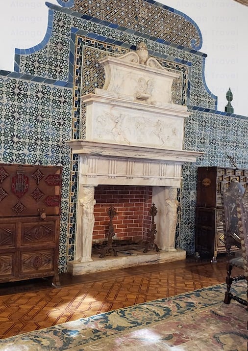 King Manuel I while fireplace surrounded by pretty ceramic tiles