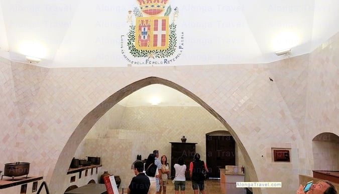 The Royal Portuguese emblem of the wall of this huge kitchen in this Royal palace in Sintra