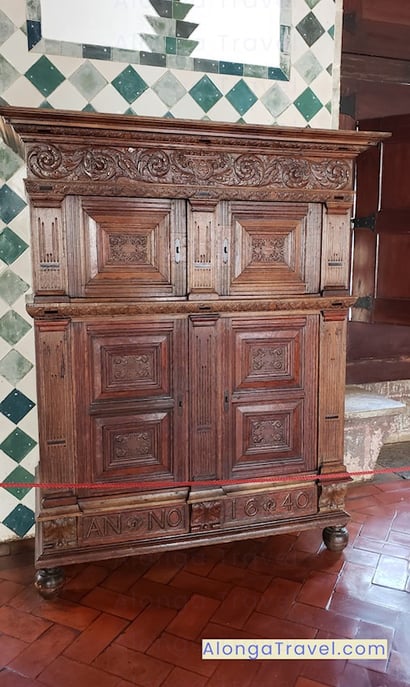 Beautiful brown cabinet in front of cheerful checkered Moorish tiles