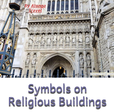 An entrance to the Abbie cathedral with many statues & symbols built over it